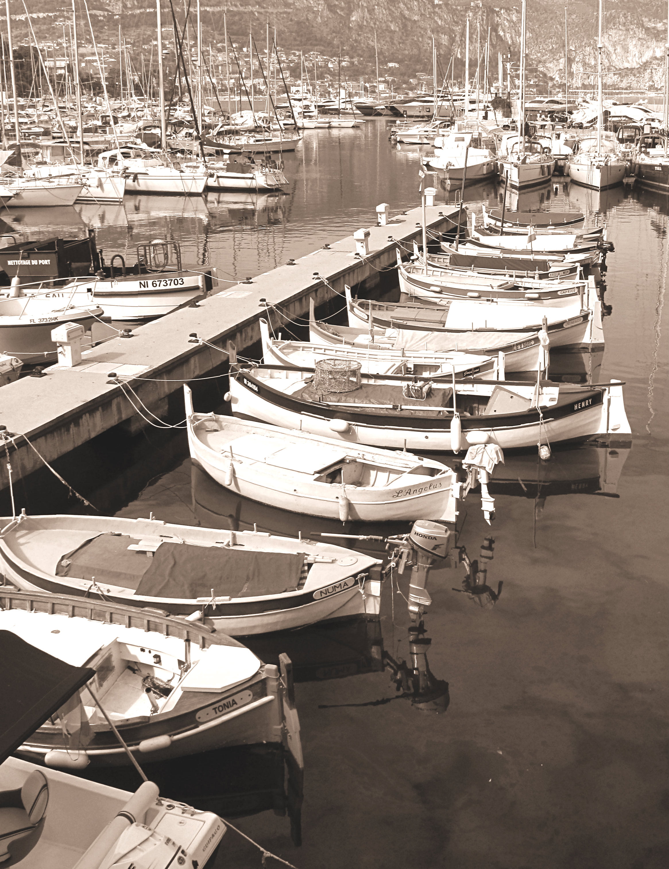 An old photo of a harbor in the French Riviera