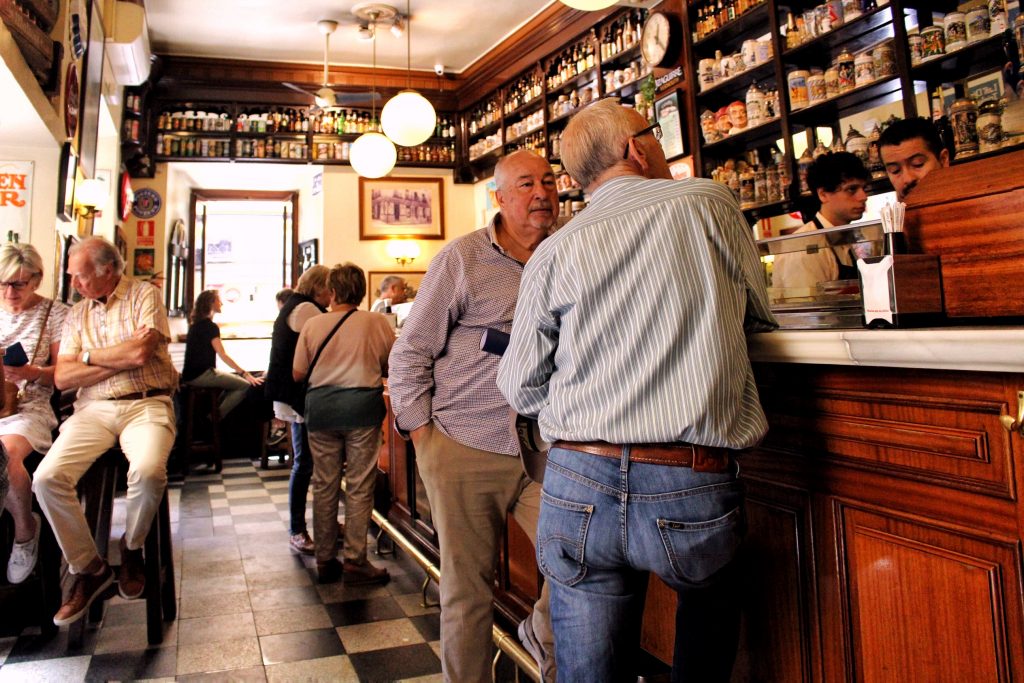 Men drinking at a bar in Madrid