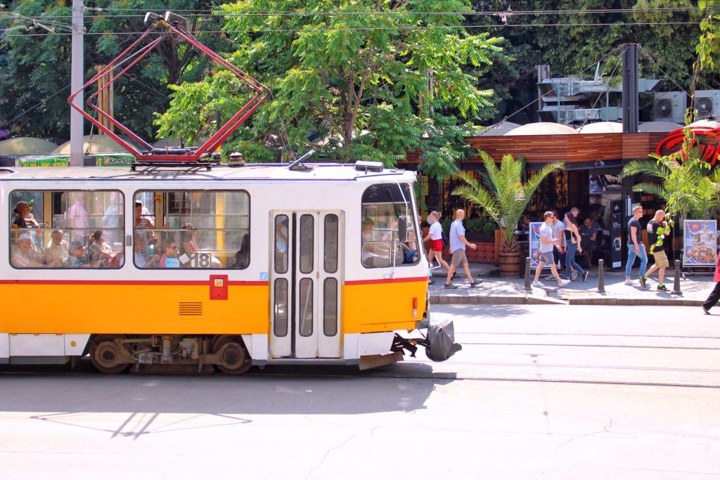 yellow tram passing