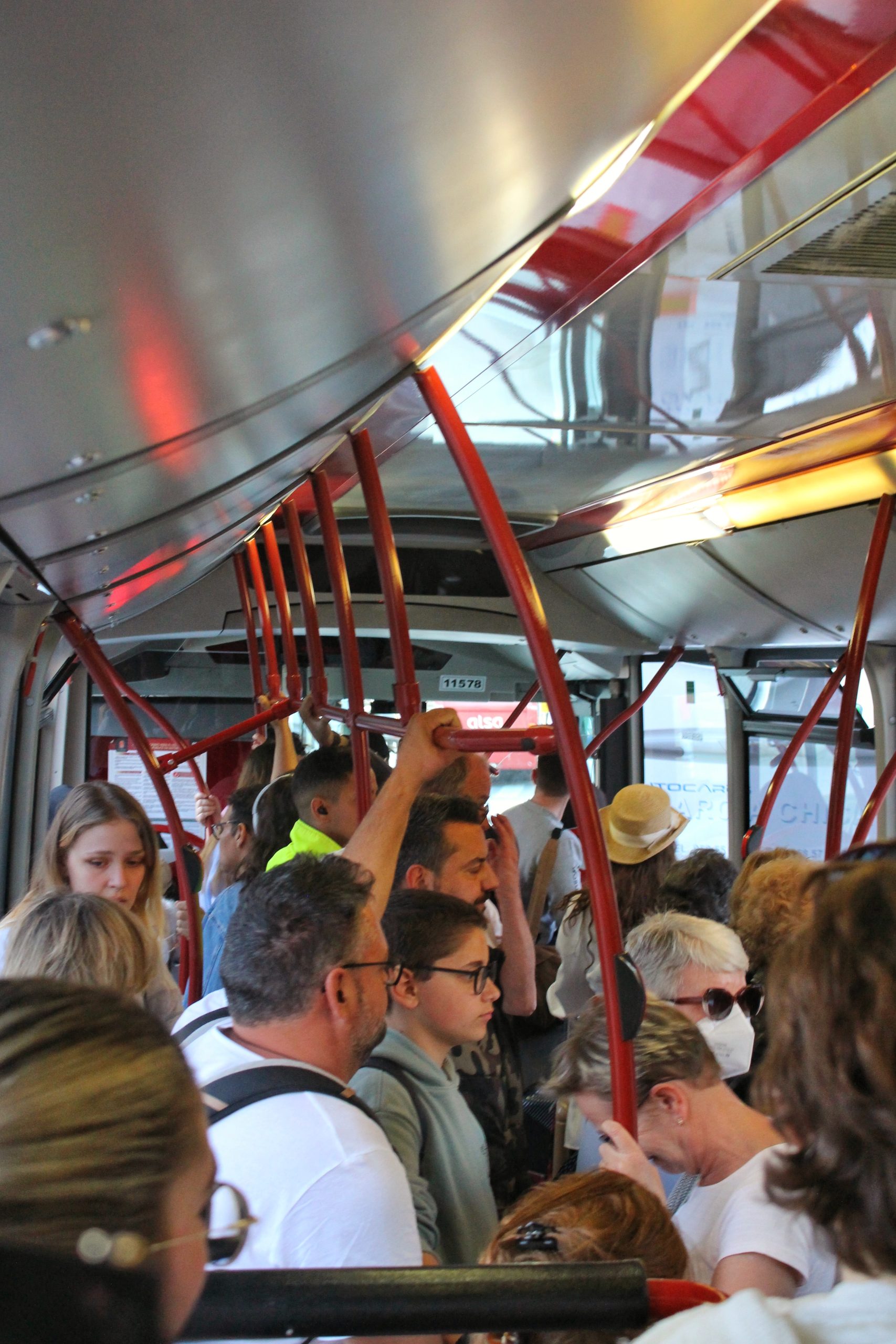 A crowded bus in the afternoon rush in city of Granada