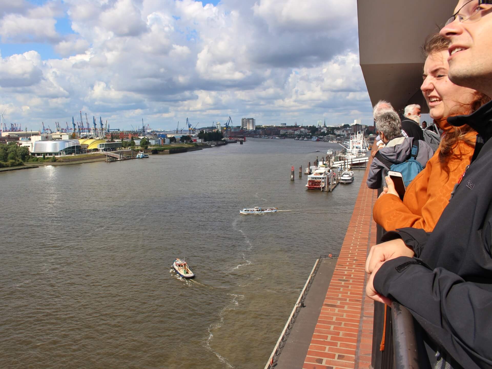 Boats and onlookers along the river 
