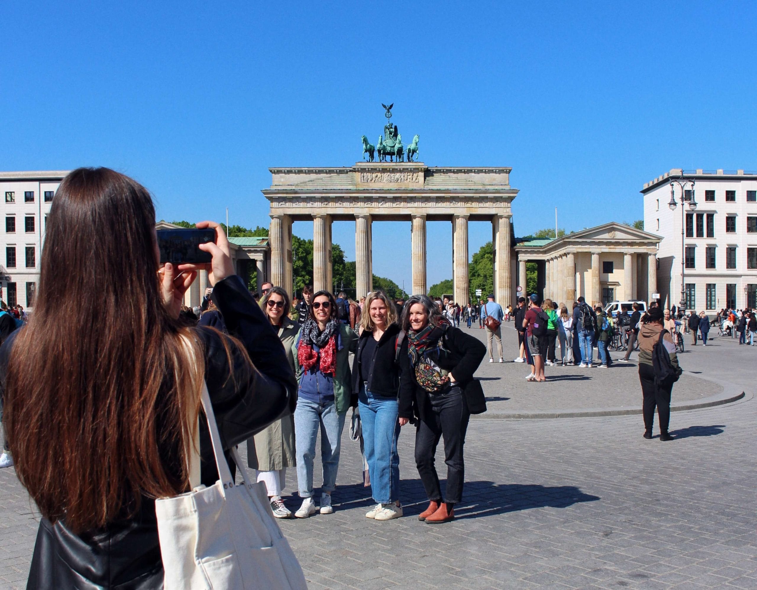 A girl snapping a photo of her friends