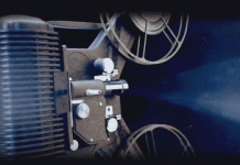 Through the LENS and LIGHT A movie projector showing a countdown on a screen